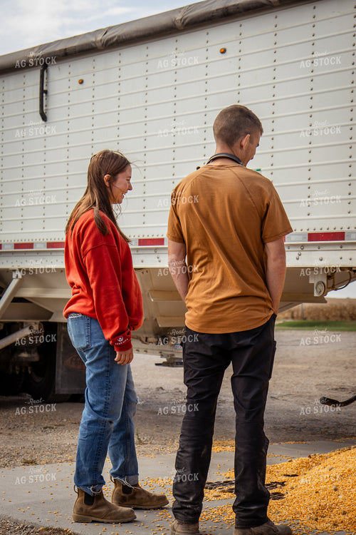 Young Farm Couple Dumping Corn in Grain Pit 268108