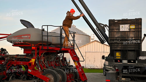 Farmer Climbing into Tractor Cab 25342