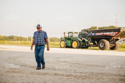Farmer Walking in Farmyard 115334