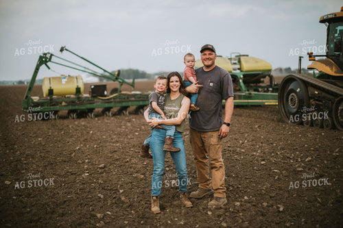 Farm Family in Field During Planting 5648