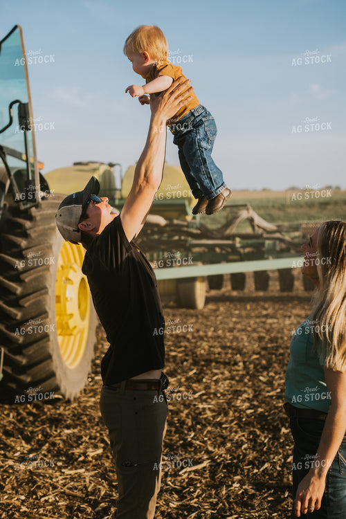 Young Farmer Throws Child in the Air  7665