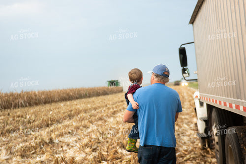 Farmer and Kid in Field 129056