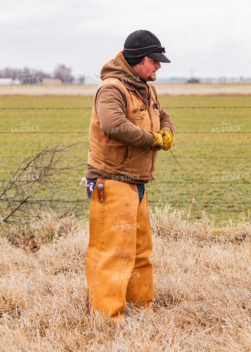 Rancher Fixing Fence 231069