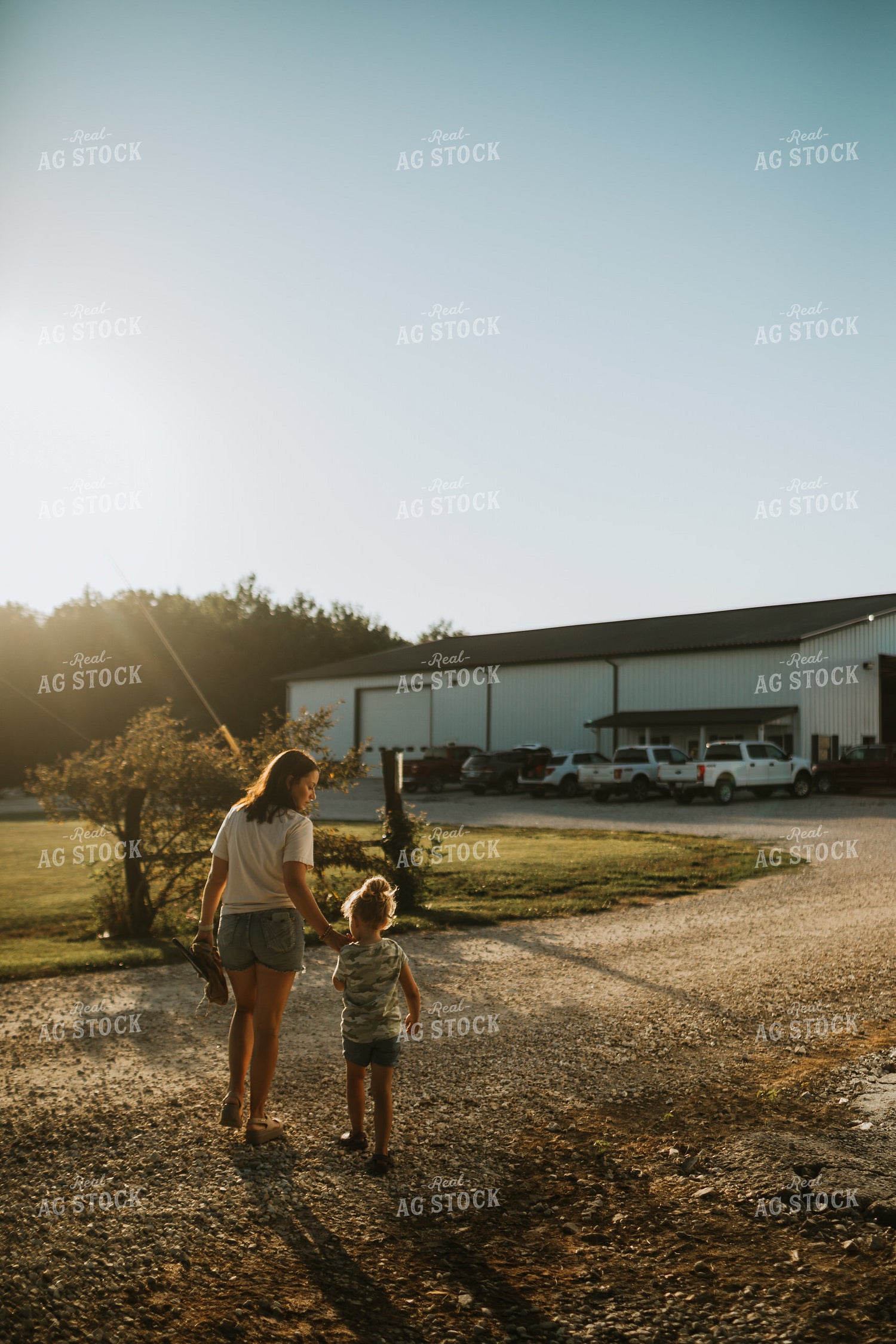 Farm Mom Walking Toward Shop with Kid 6258