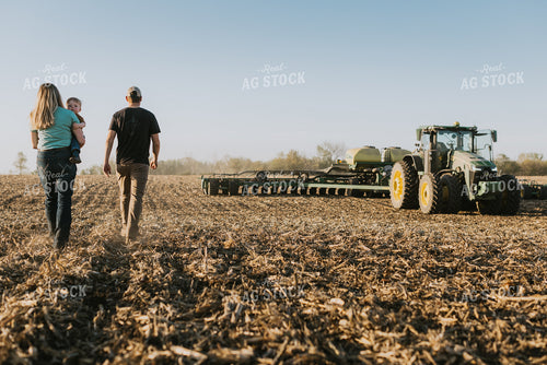 Young Couple with Child Walk Toward Tractor 7674