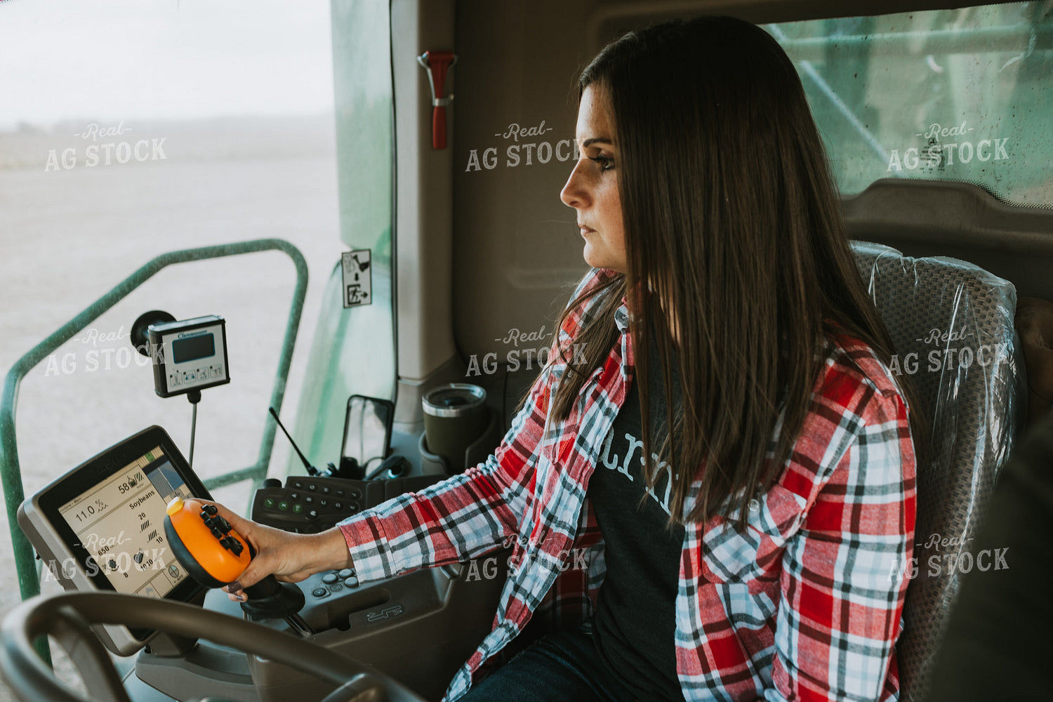 Female Farmer Driving Combine 3489