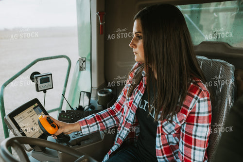 Female Farmer Driving Combine 3489