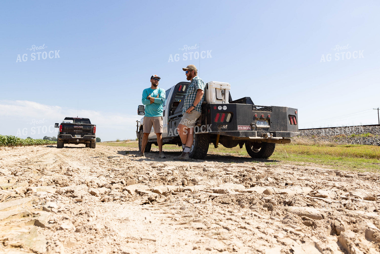 Farmers Leaning on Truck Talking 79677