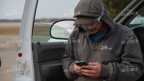 Farmer Using Phone by Truck 26232