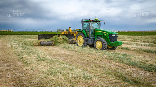 Tractor with Merger in Hay Field 56412