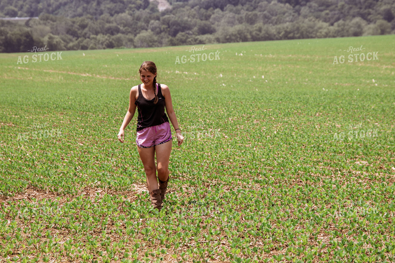 Female Farmer Walking in Soybeans 52220