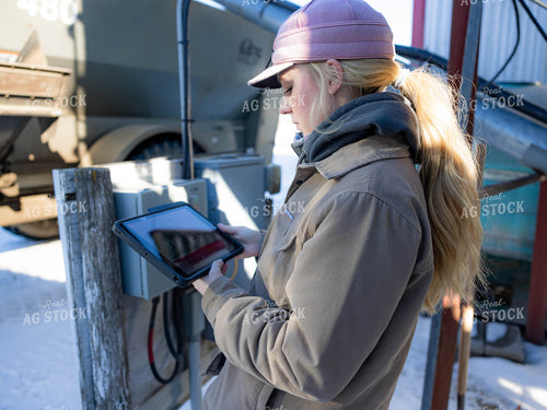 Rancher Looking at Tablet 70207