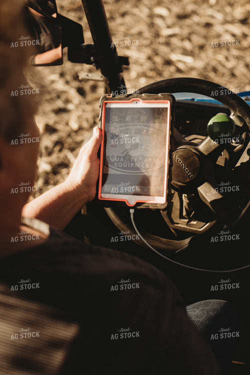 Farmer in Side by Side UTV with iPad 3728