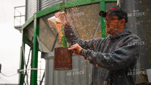 Farmer Testing Corn Moisture On-farm Storage 25623
