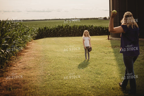 Farm Family Playing Catch Alongside Corn Field 4480