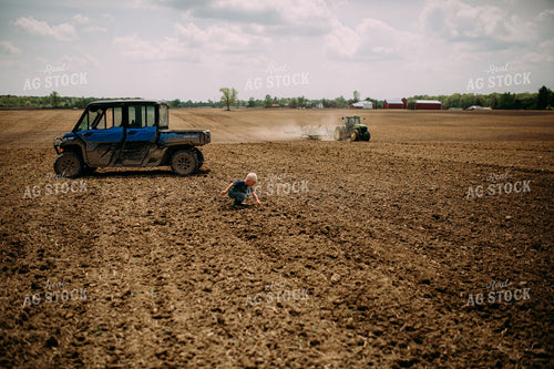 Farm Kid and Mom Picking Up Rocks 169097