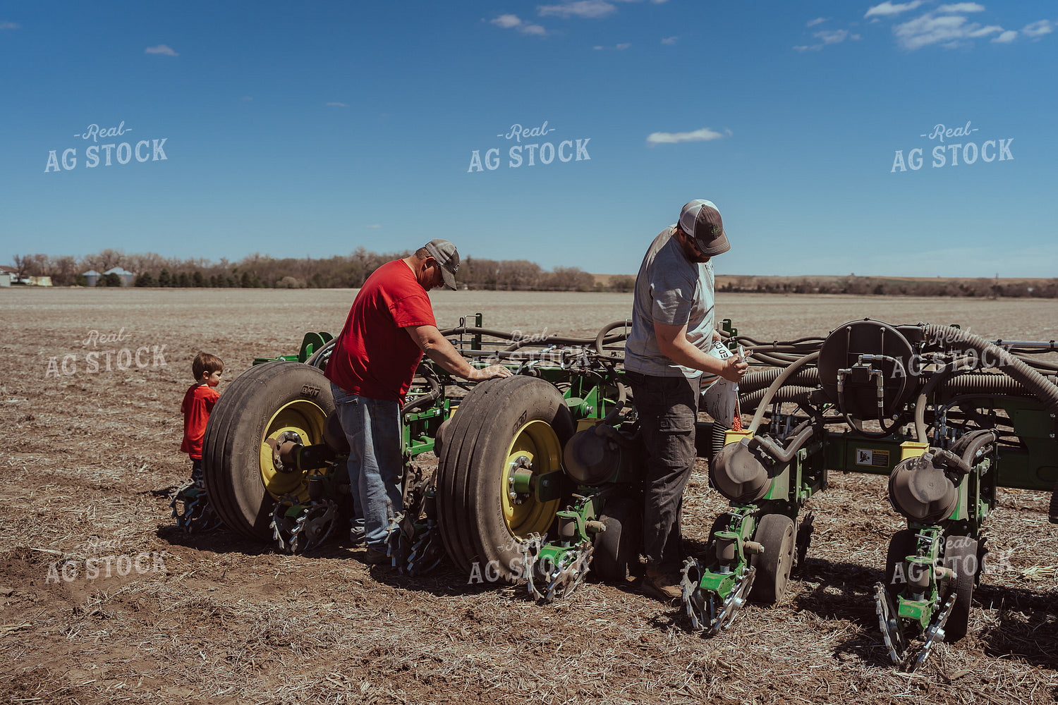 Farmer Filling Planter for Test Plot 196126