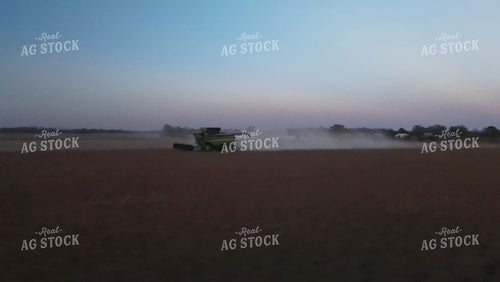 Aerial of Soybean Harvest with Trucks and Combine at Sunset 7383