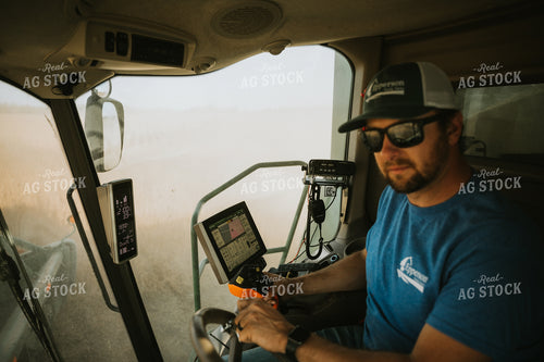 Farmer Operating Combine 7104