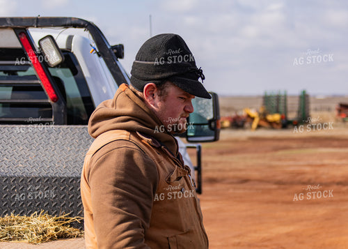 Rancher Leaning on Truck 231082