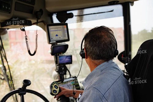 Farmer in Combine Cab 152279