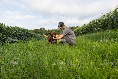 Farmer Bonding with Dog 79700