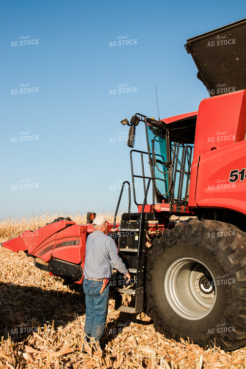 Farmer Climbing into Combine 67971