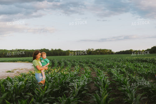 Female Farmer and Son Checking Corn 8780