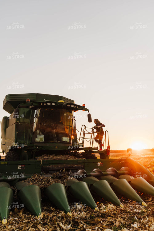 Farmer Climbing into Tractor 115136