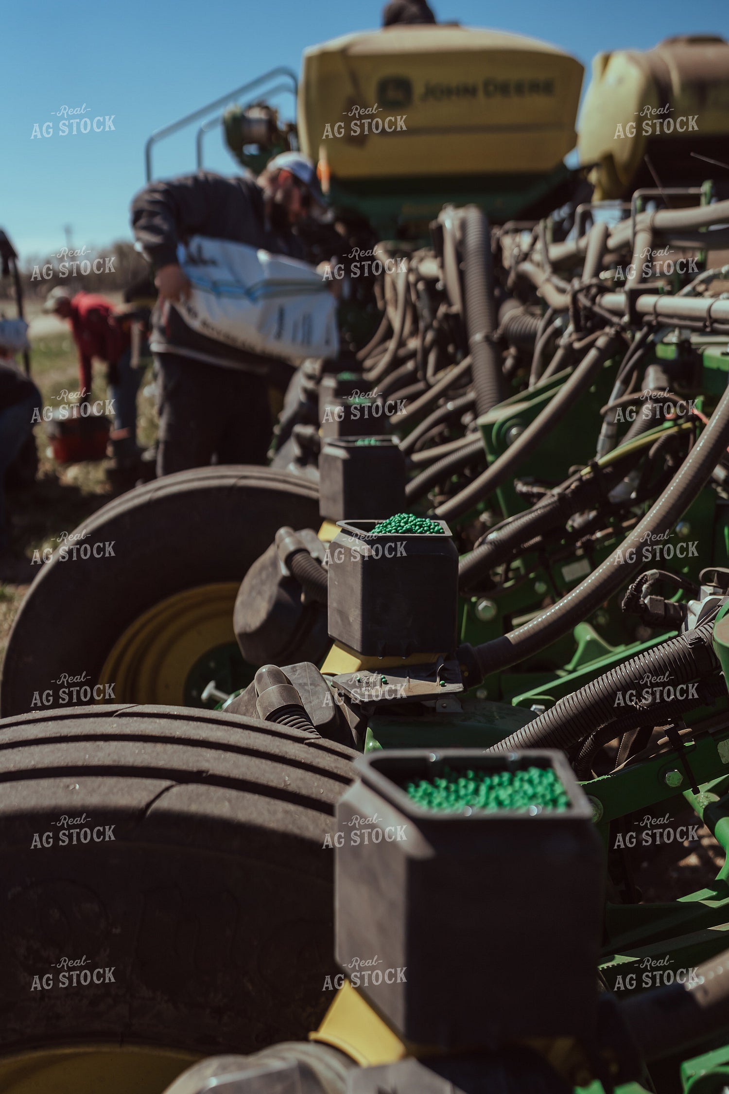 Farmer Filling Planter for Test Plot 196096