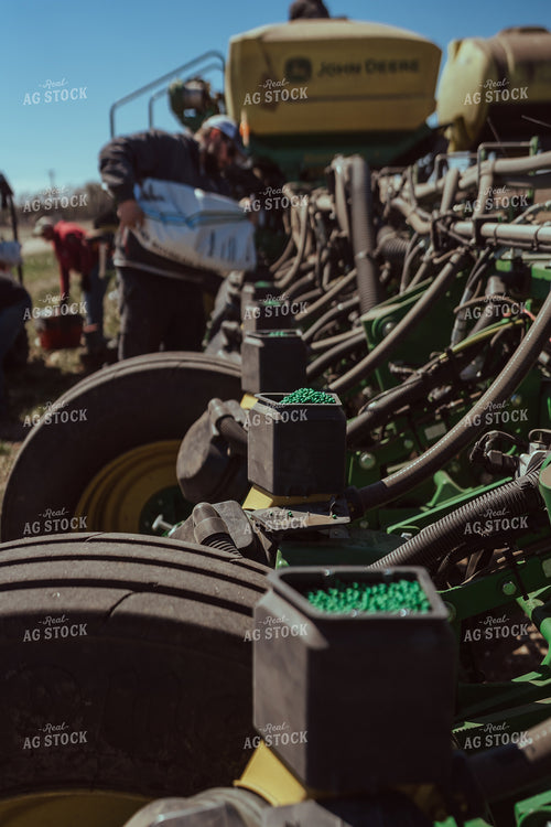 Farmer Filling Planter for Test Plot 196096