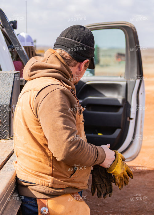 Rancher Leaning on Truck 231081