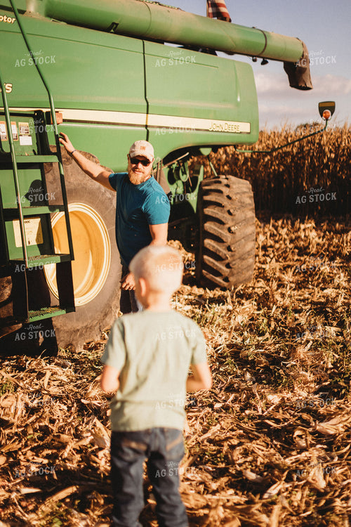 Farmer and Son Getting into Combine 9364