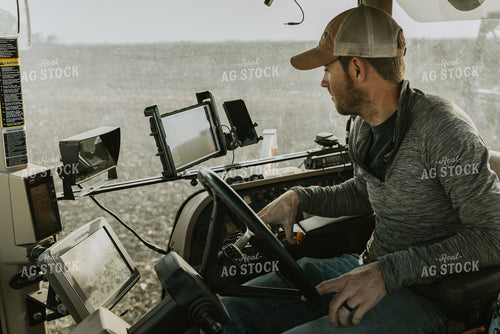 Farmer in Tractor Cab 8184