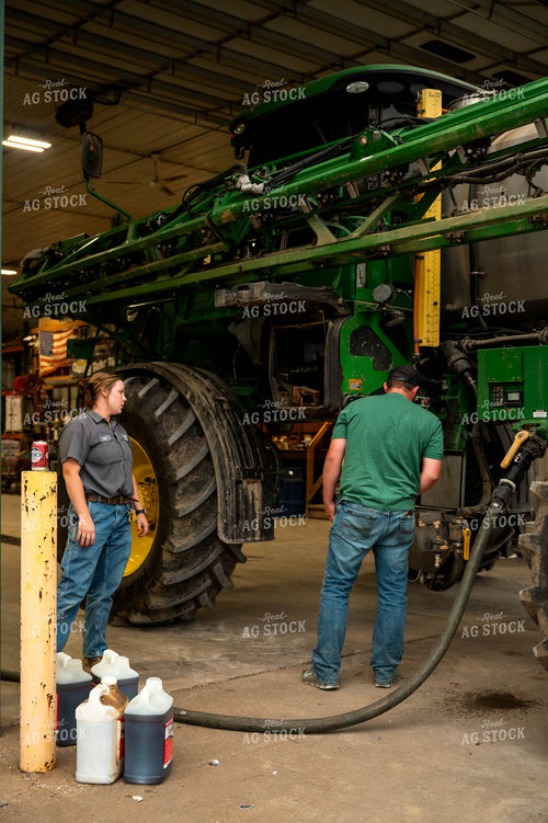 Farmers Filling Self-Propelled Sprayer 115740