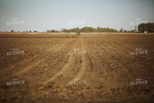 Tractor Pulling Planter in Field 6364