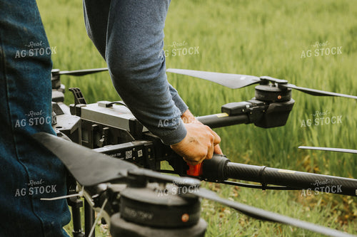 Farmer Prepares Drone for Flight 101040
