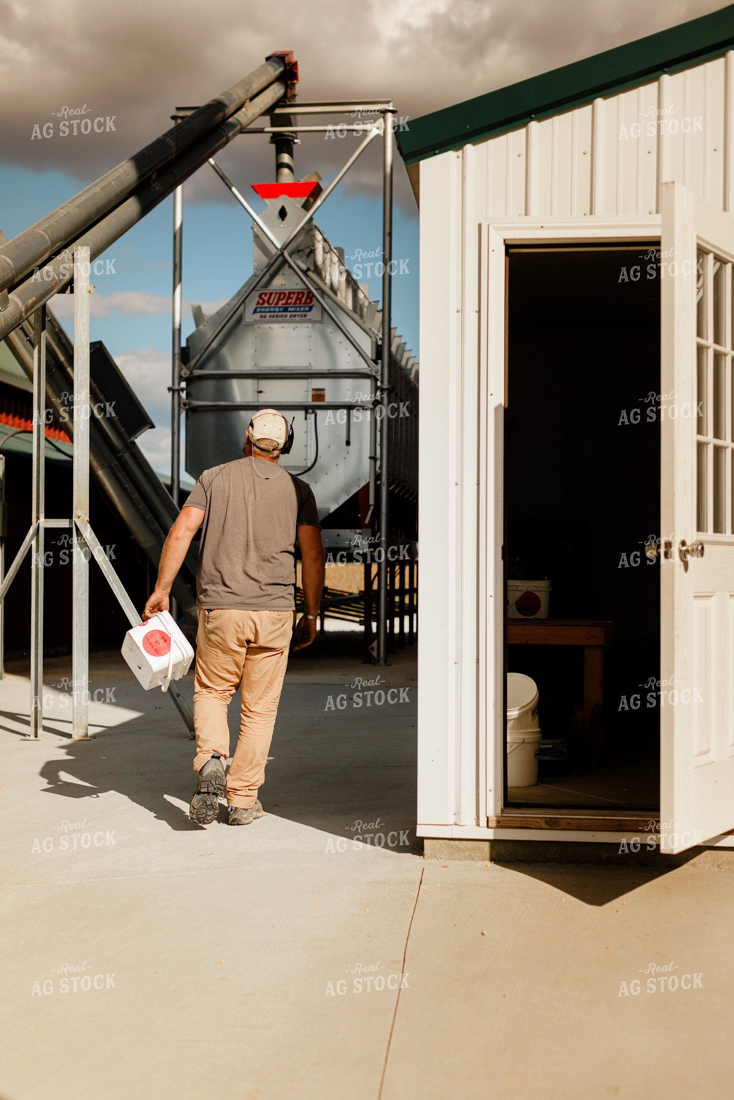 Farmer Checking Moisture of Stored Corn 9318
