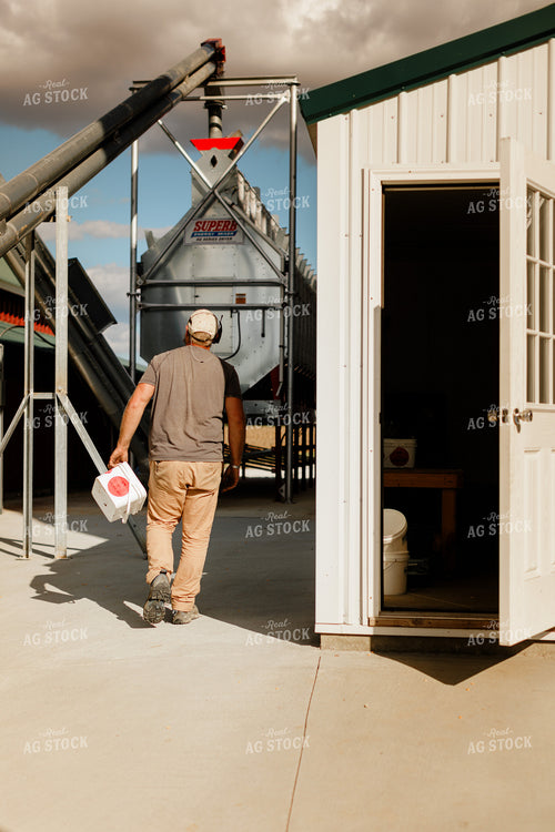 Farmer Checking Moisture of Stored Corn 9318