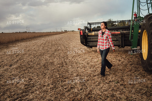 Female Farmer Getting Out of Combine 3499