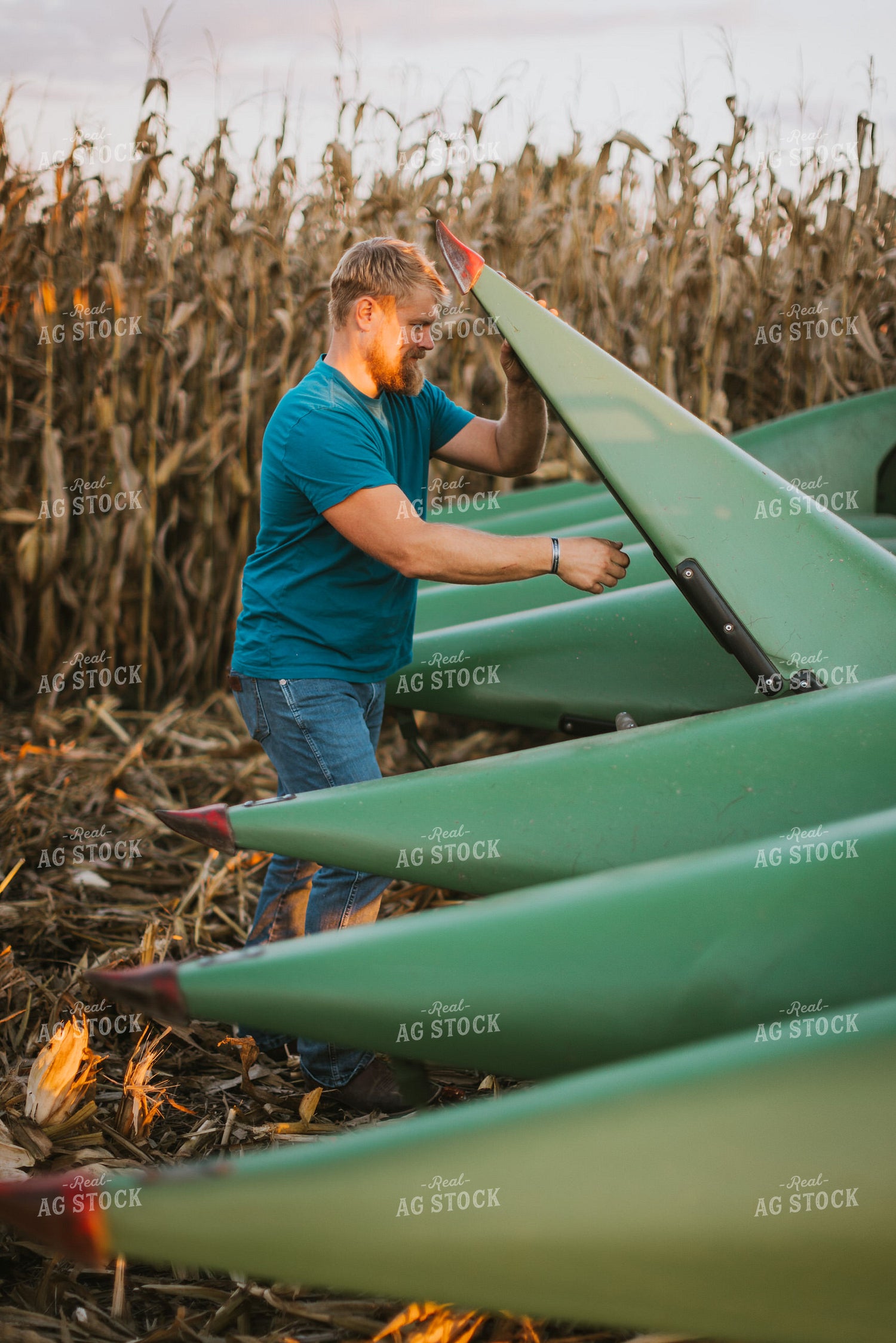 Farmer Fixing Combine Head 9390
