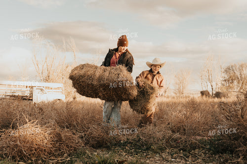 Female Rancher and Kid Doing Chores 61247