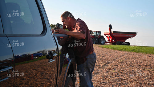 Farmer Looking For Supplies in Truck Bed 25508