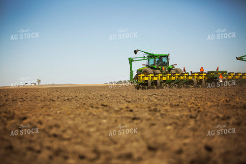 Tractor Pulling Planter in Field 6366