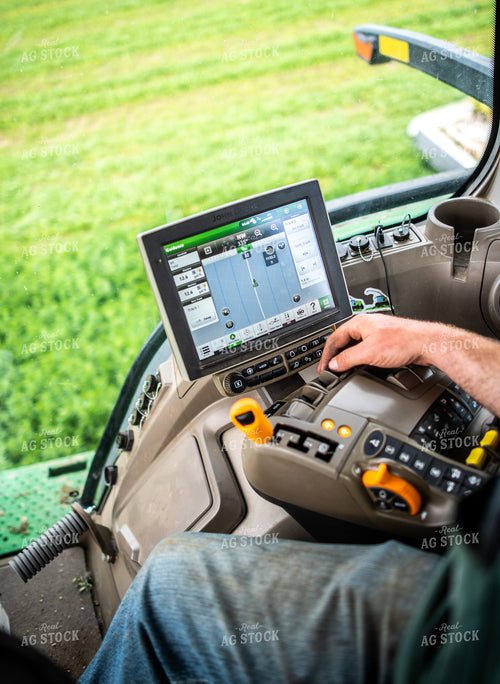 Farmer Driving Tractor with Equipment GPS Monitor Visible 56671