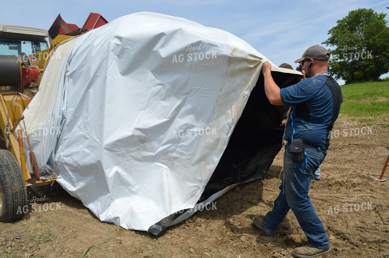 Farmer Setting Up Flat Stoage Bag 206048