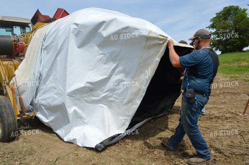Farmer Setting Up Flat Stoage Bag 206048