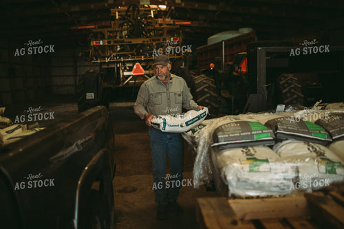 Farmer Loading Seed Bags 4077