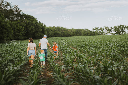 Farm Family Checking Corn 8730