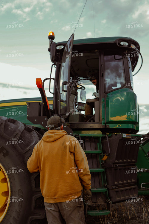 Farmer Climbing into Tractor 187378